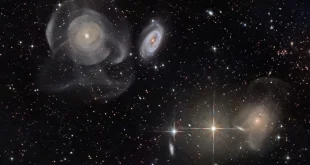 سیستم کهکشانی Arp 227 در سمت چپ تصویر دیده می‌شود.