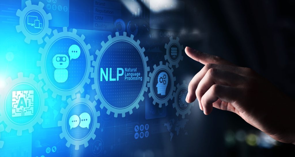 پردازش زبان طبیعی چیست؟ بازدید کامل مفاهیم و کاربردهای NLP_دلچسب 10 دست یک شخص در حال لمس تصویر اسکریم که ر روی آن نوشته شده nlp